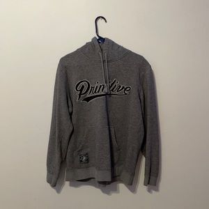 A large men’s grey primitive hoodie.